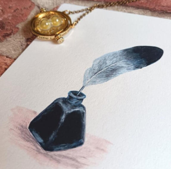 A delicate hand-painted pigeon feather quill and black ink bottle.