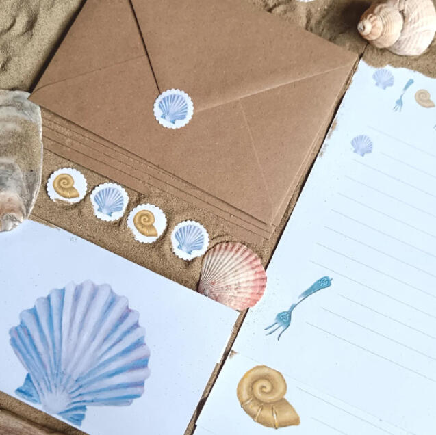 A coastal writing set illustrated with shells and forks inspired by The Little Mermaid